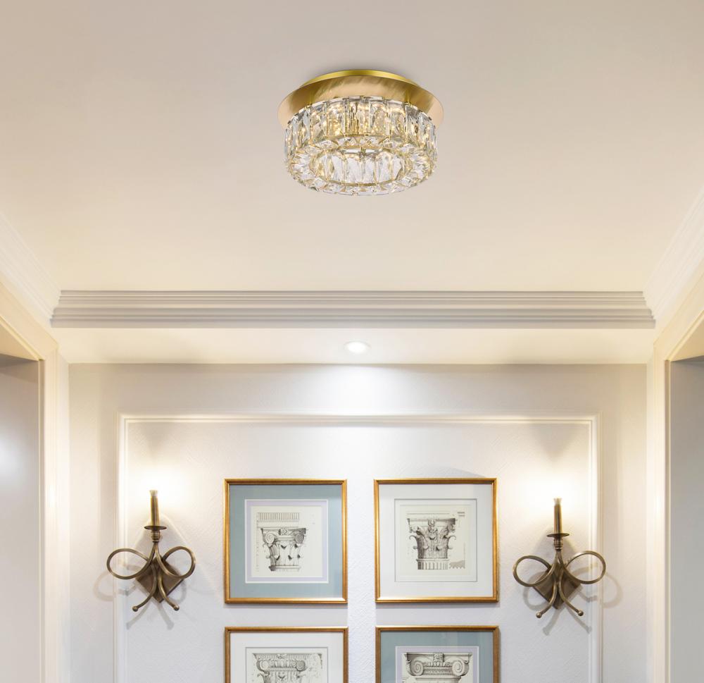 Monroe ceiling light fixture in a room with framed pictures and wall sconces.