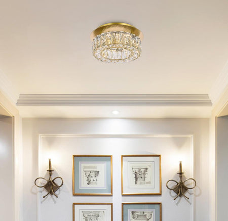 Monroe ceiling light fixture in a room with framed pictures and wall sconces.