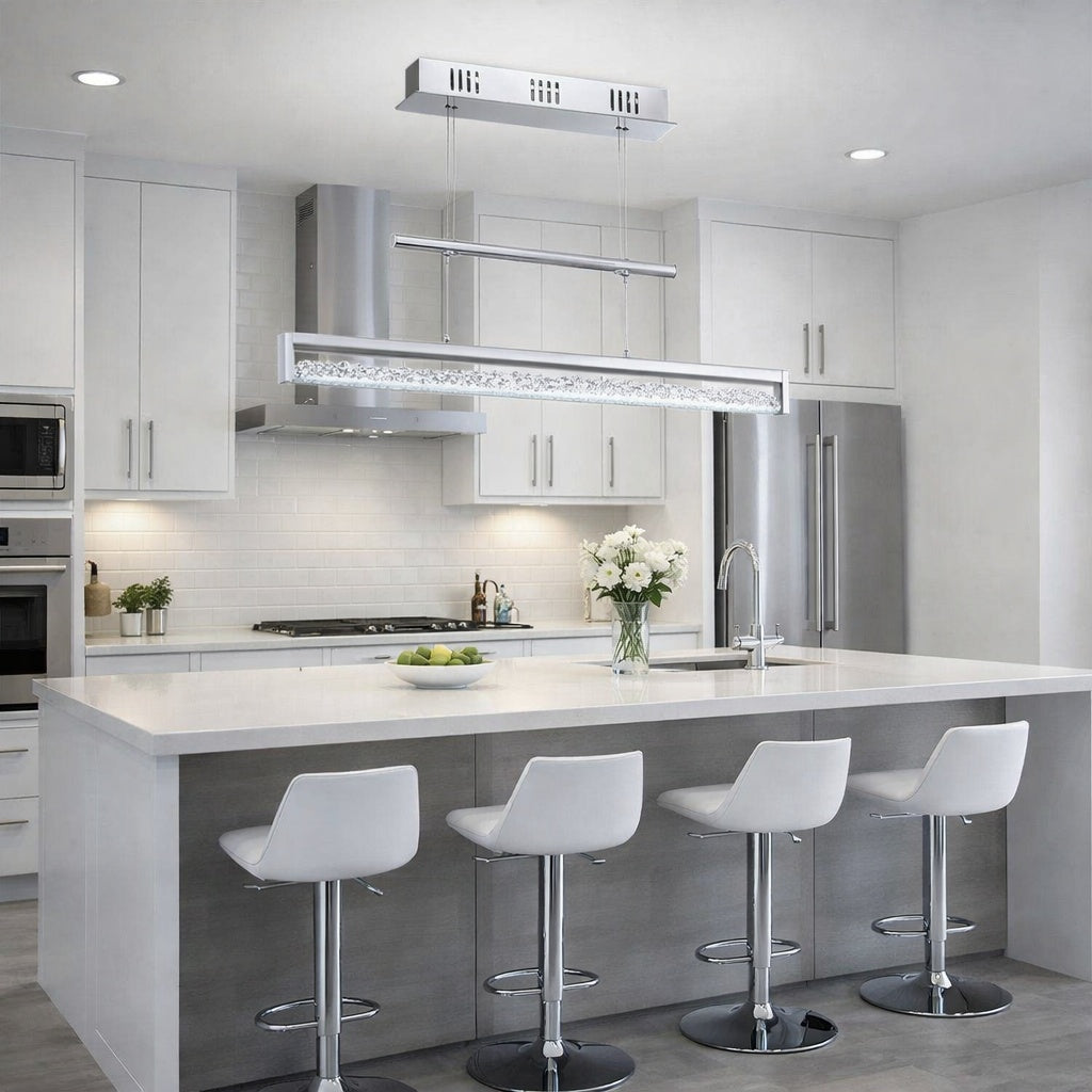 Modern kitchen with white island, stools, and stainless steel appliances.