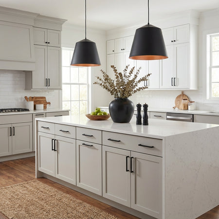 Modern kitchen with 2 black pendants by TransGlobe, a central island, wooden countertops, and neutral color scheme.