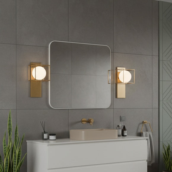 Squircle geometric wall sconce with frosted glass in Aged Gold Brass by Matteo