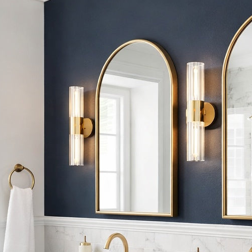 Odette collection tubular vanity light in Aged Gold Brass by Matteo